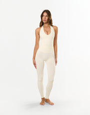 Front view of STAX. V Premium Seamless Skulpt Halter Tank in Cream showing ribbed waist panel and removable padding/cups