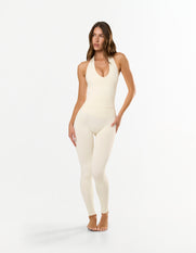Front view of STAX. V Premium Seamless Skulpt Halter Tank in Cream showing flattering compressive fit