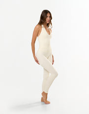 Front view of STAX. V Premium Seamless Skulpt Halter Tank in Cream showing compressive fit with ribbed waist panel