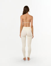 Back view of STAX. Premium Seamless Skulpt Bralette in Cream showing Strappy halter neck and back design
