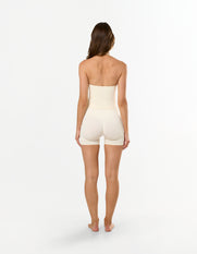 Back view of STAX. V Premium Seamless Skulpt Halter Tank in Cream showing halter neck design and compressive fit