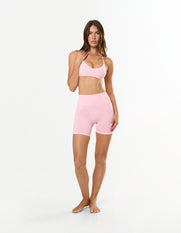 Front profile of STAX. Premium Seamless Skulpt Bralette in Pink showing Strappy halter neck design