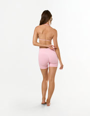 Back view of STAX. Premium Seamless Skulpt Bralette in Pink showing Strappy halter neck and back design