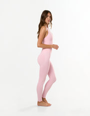 Side view of STAX. V Premium Seamless Skulpt Halter Tank in Pink showing flattering compressive fit