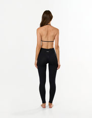 Back view of STAX. Premium Seamless Skulpt Bralette in Black showing flattering open back detail