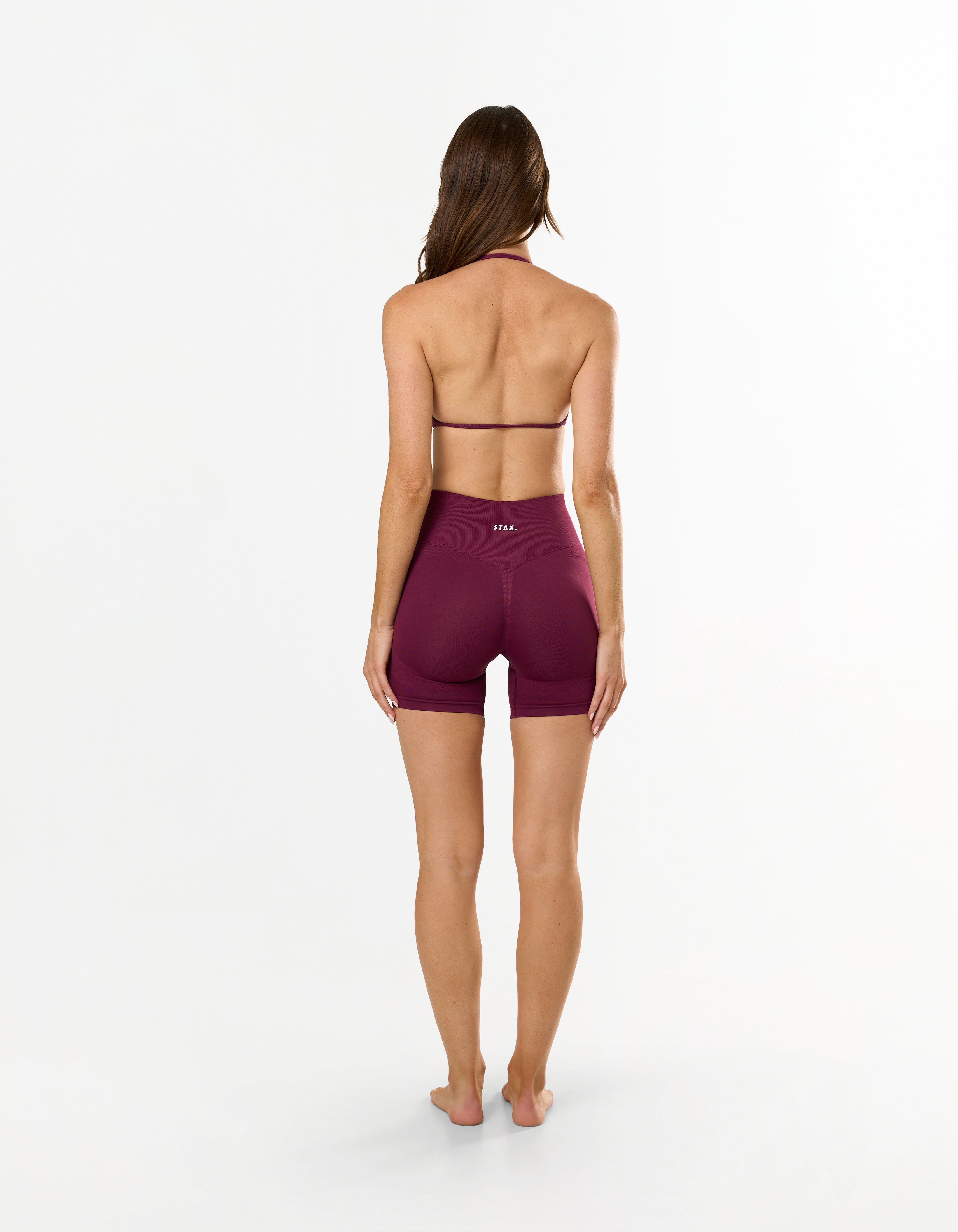 Back view of STAX. Premium Seamless Skulpt Bralette in Burgundy showing flattering open back detail