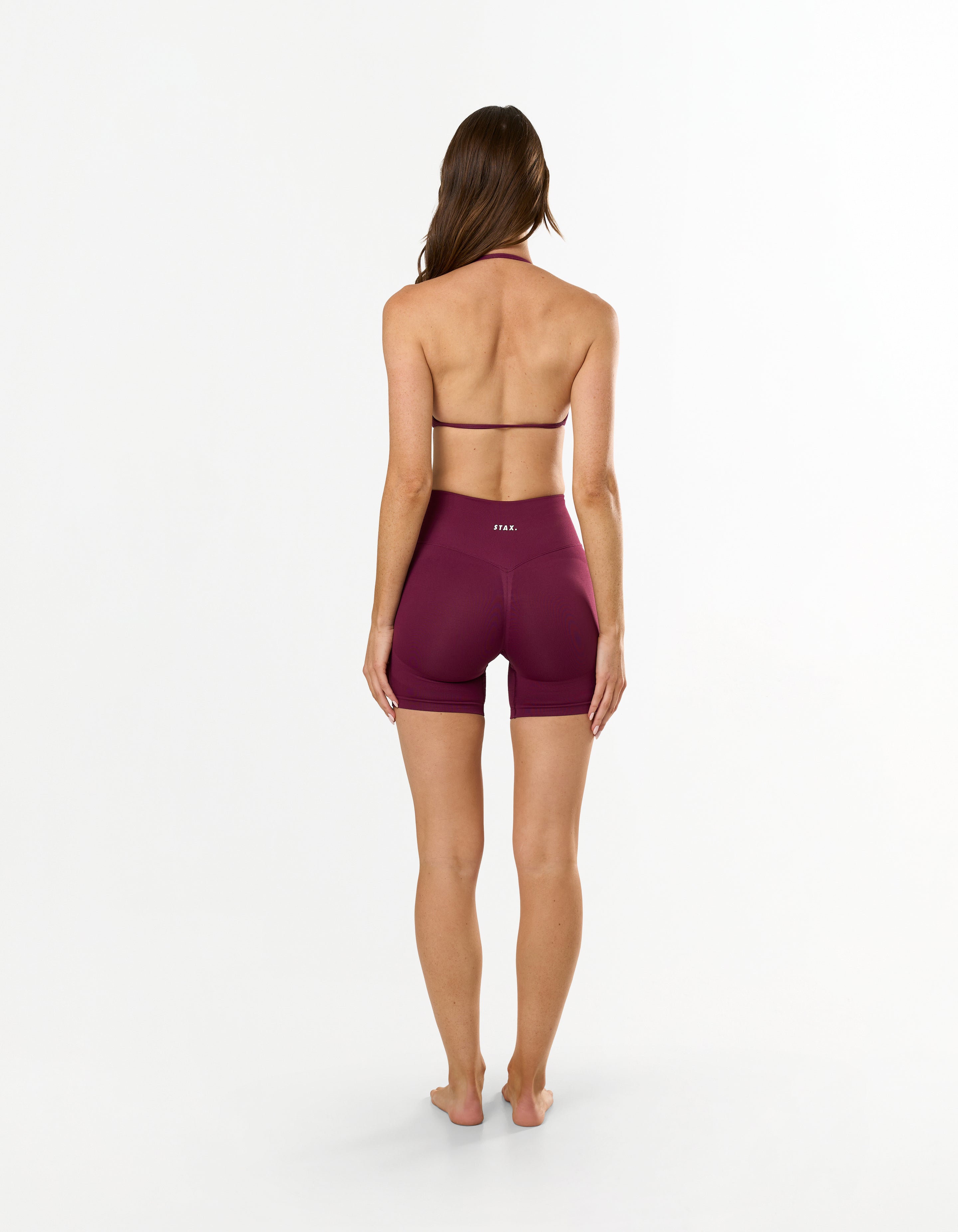 Back view of STAX. Premium Seamless Skulpt Bralette in Burgundy showing flattering open back detail