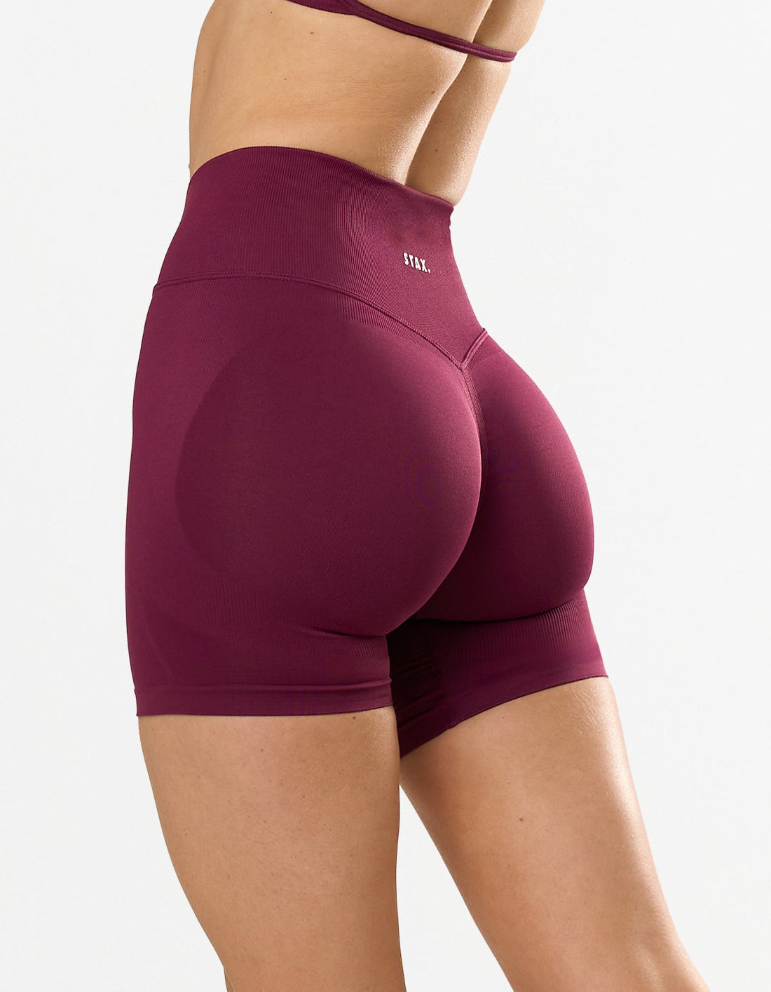 STAX. Premium Seamless Skulpt Midi Bike Shorts in Burgundy - Compressive Fit - Skulpt Tights showing flattering invisible scrunch detail 