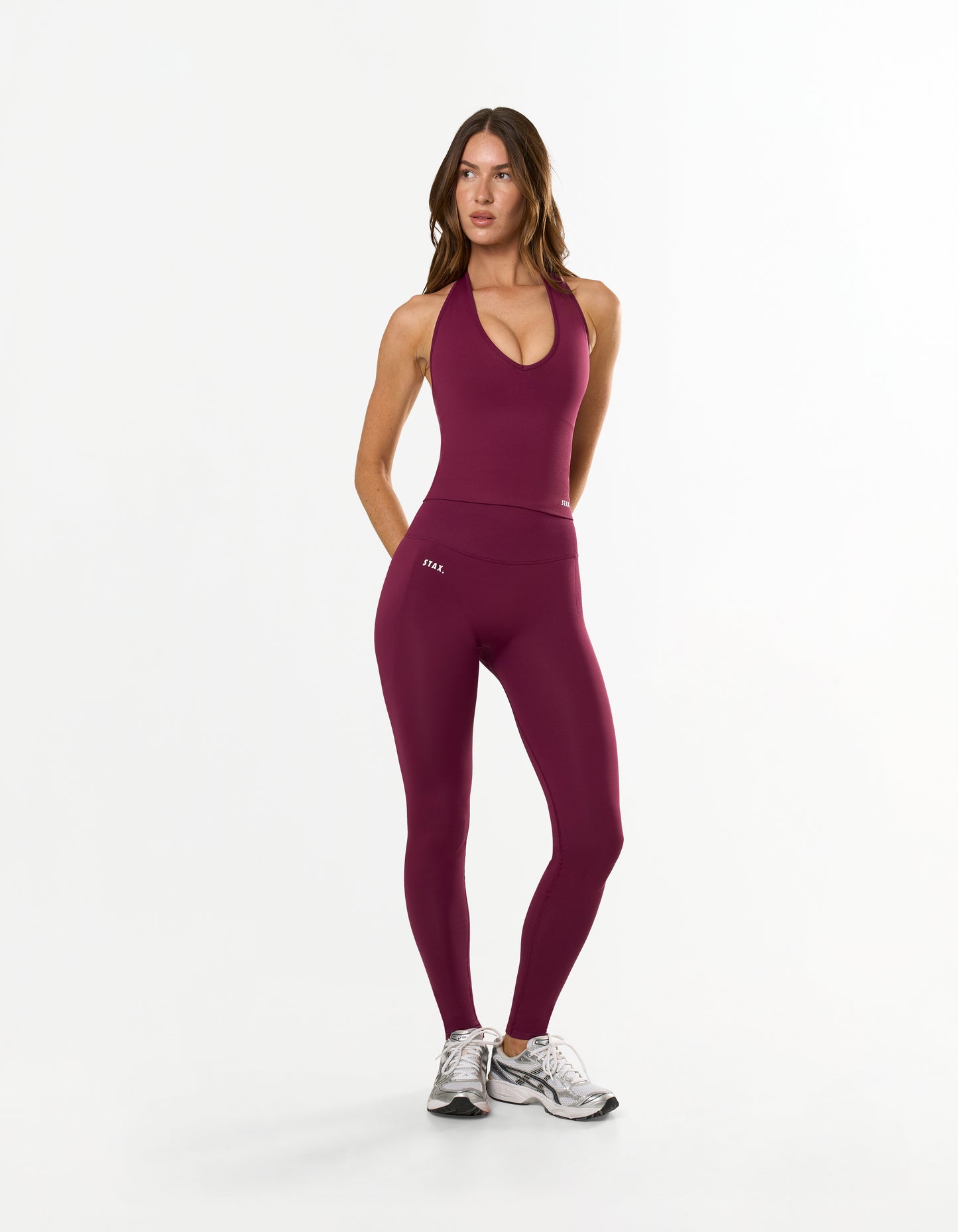 Front view of model wearing STAX. Premium Seamless Skulpt Tights in Burgundy showing compressive second-skin fit