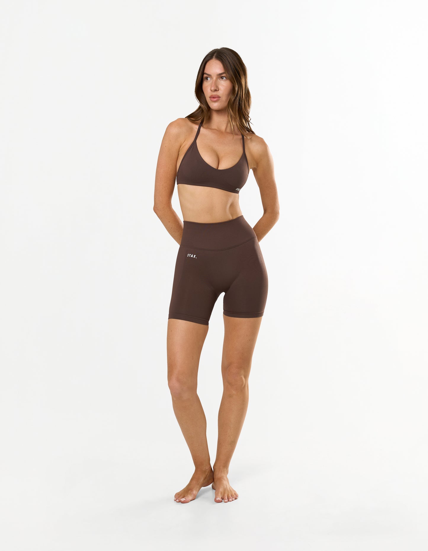 Back view of STAX. Premium Seamless Skulpt Bralette in Brown with strappy halter neck design