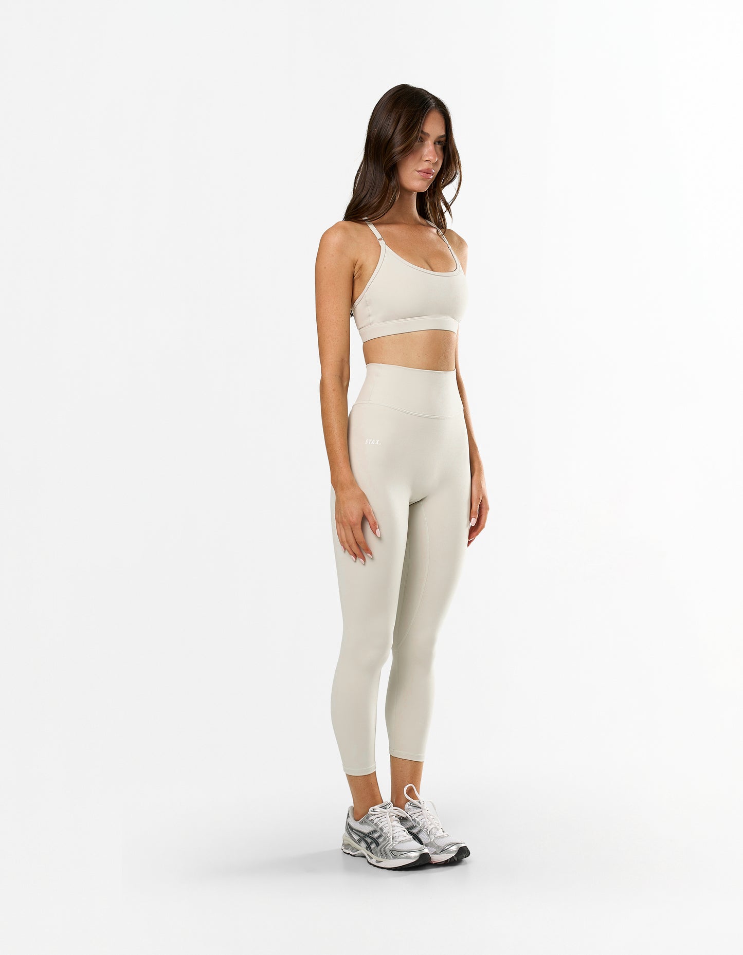 Side profile of STAX. NFS 7/8 Tights NANDEX™ in Oat showing high waist flattering fit