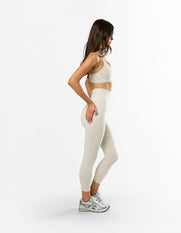 Side profile of STAX. NFS 7/8 Tights NANDEX™ in Oat showing unmatched support and flexibility 