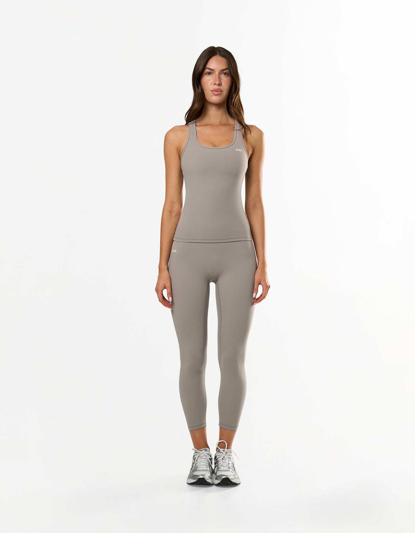 Side profile of STAX. Body Tank NANDEX™ in Taupe showing full body flattering fit and low cut scoop neck and matching NFS 7/8 Tights NANDEX™