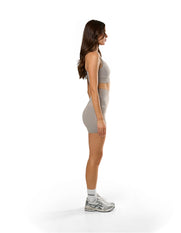 Side profile of STAX. Adapt Crop NANDEX™ in Taupe with matching NFS Midi Bike Shorts NANDEX™