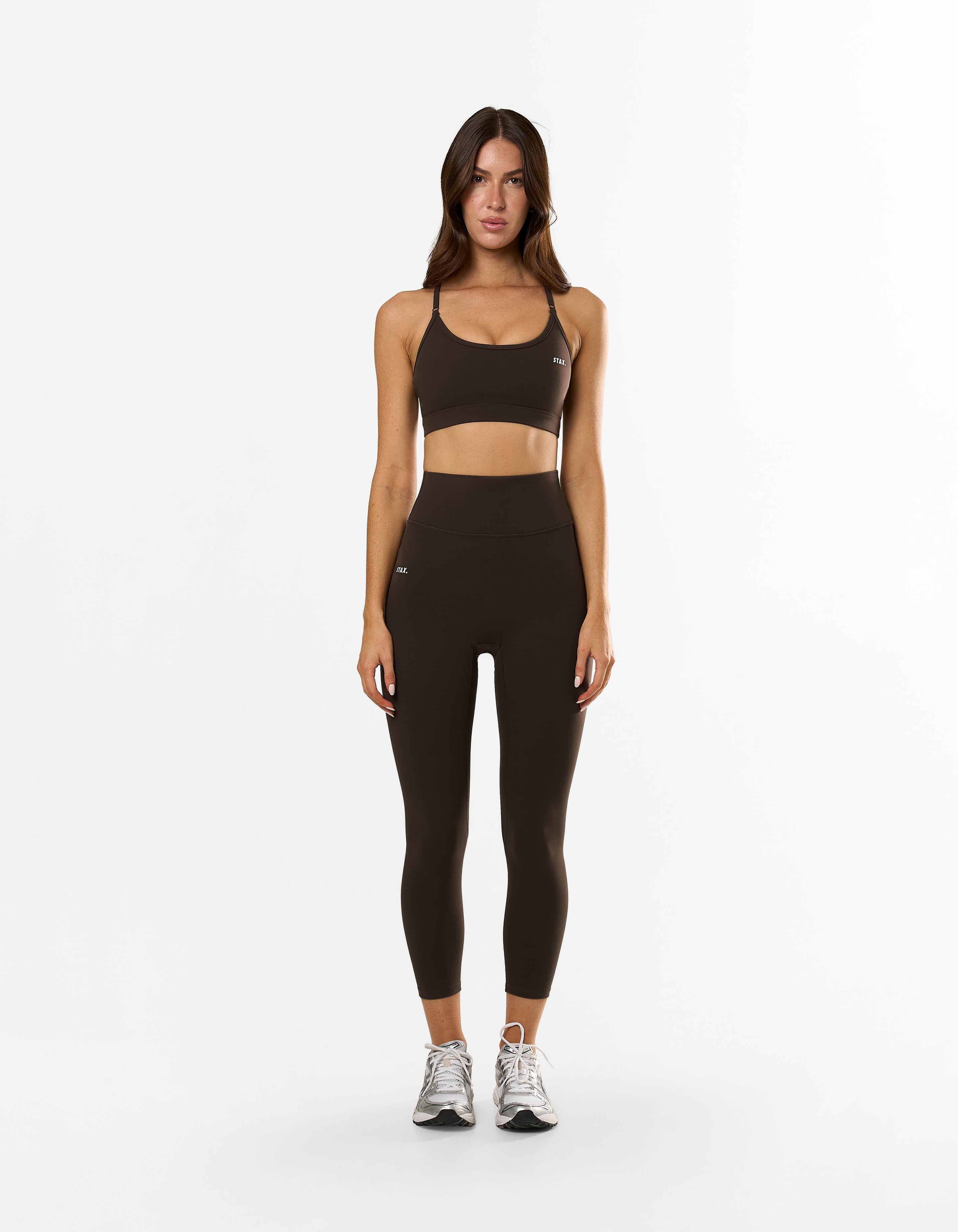 Front view of model wearing STAX. NFS (No Front Seam) 7/8 Tights NANDEX™ in Espresso showing small white logo