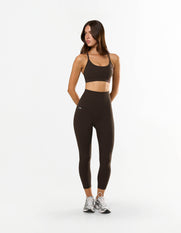 Front view of model wearing STAX. NFS (No Front Seam) 7/8 Tights NANDEX™ in Espresso with matching NANDEX™ strappy crop