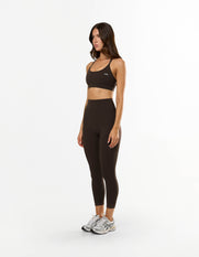 Front view of model wearing STAX. Strappy Crop NANDEX™ in Espresso with removable padding and 7/8 Tights NANDEX™ 