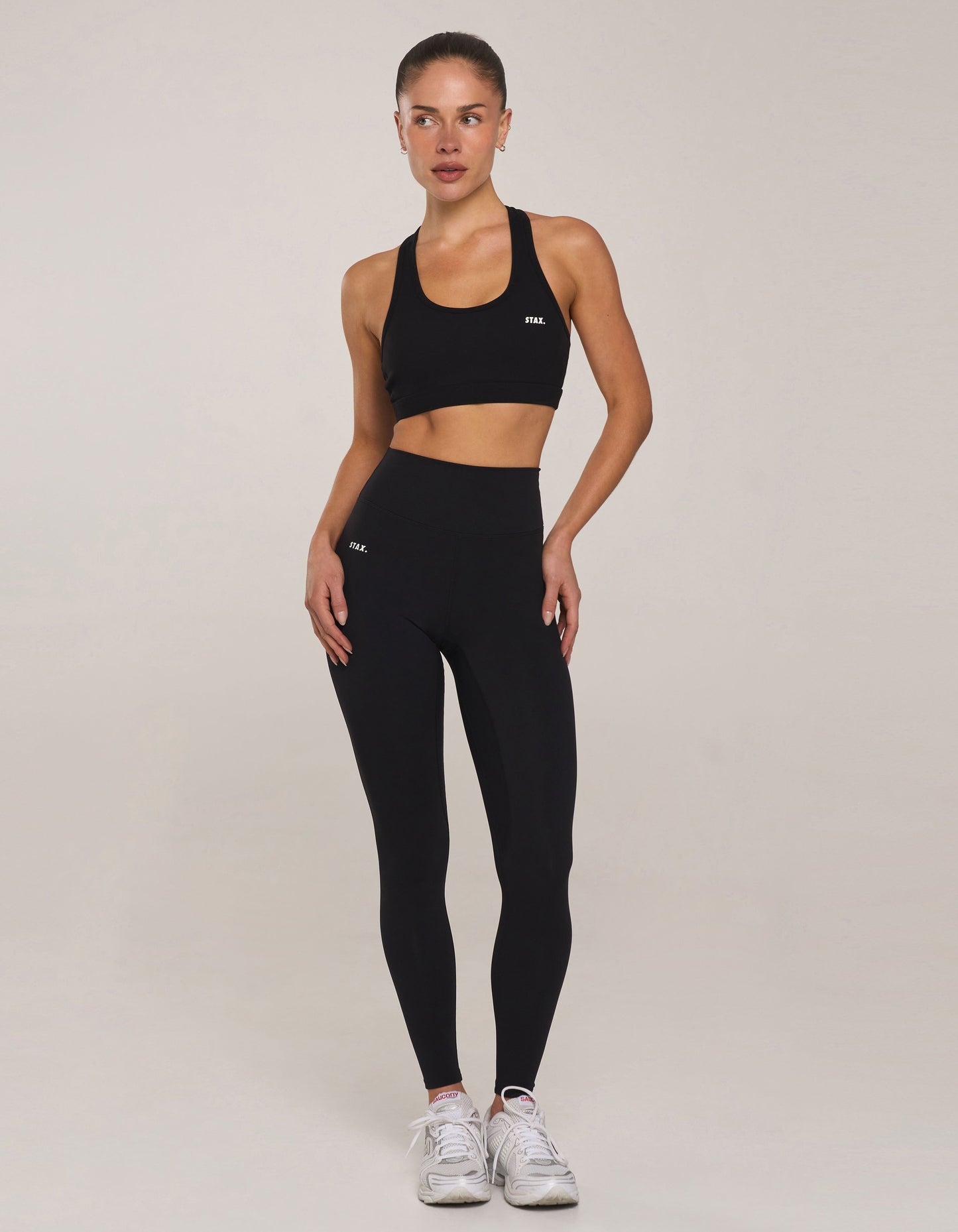 Front view of model wearing STAX. Full Length Tights NANDEX™ Original in Black with matching sports bra