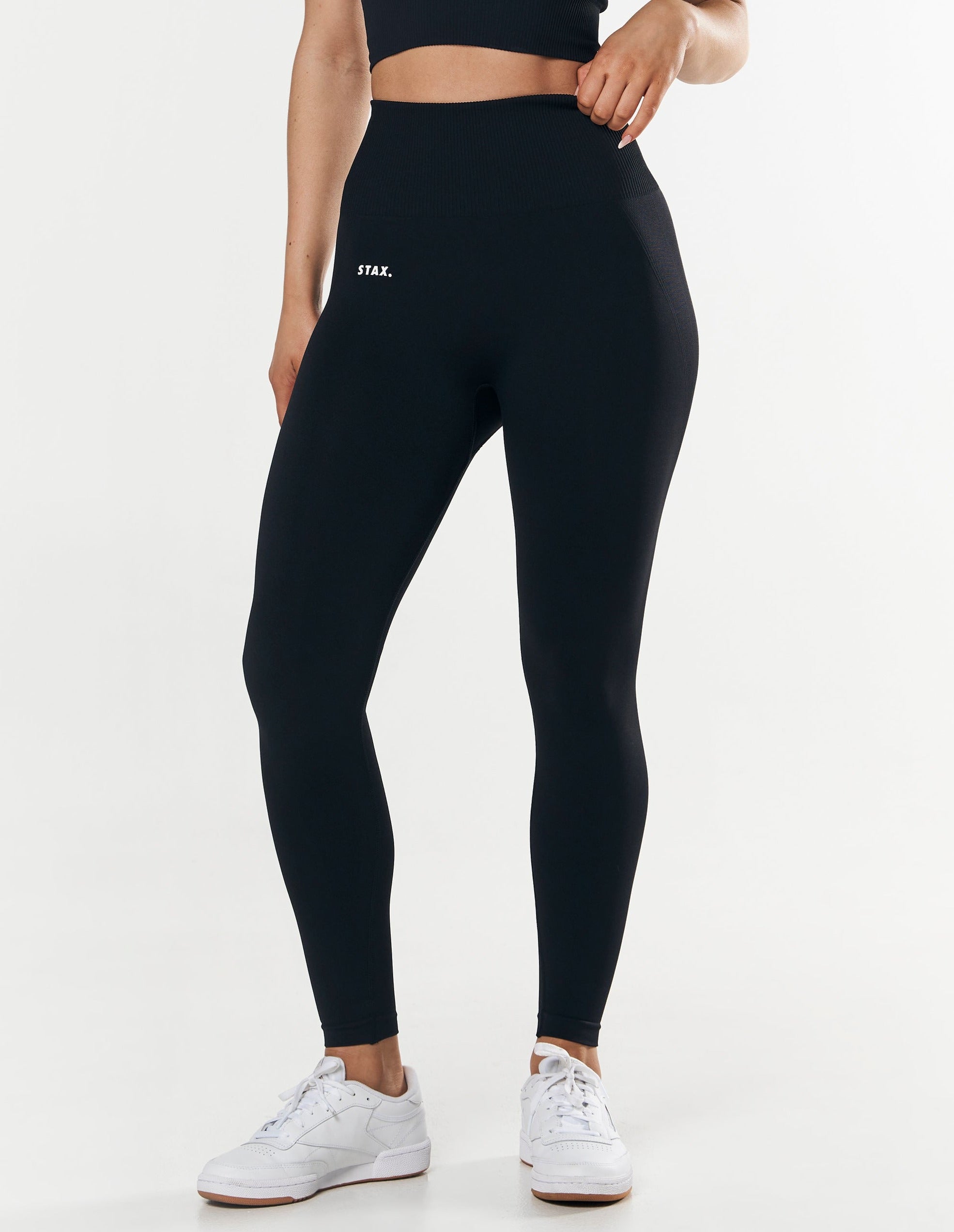 Front view close up of model wearing STAX. Premium Seamless Tights in Astro