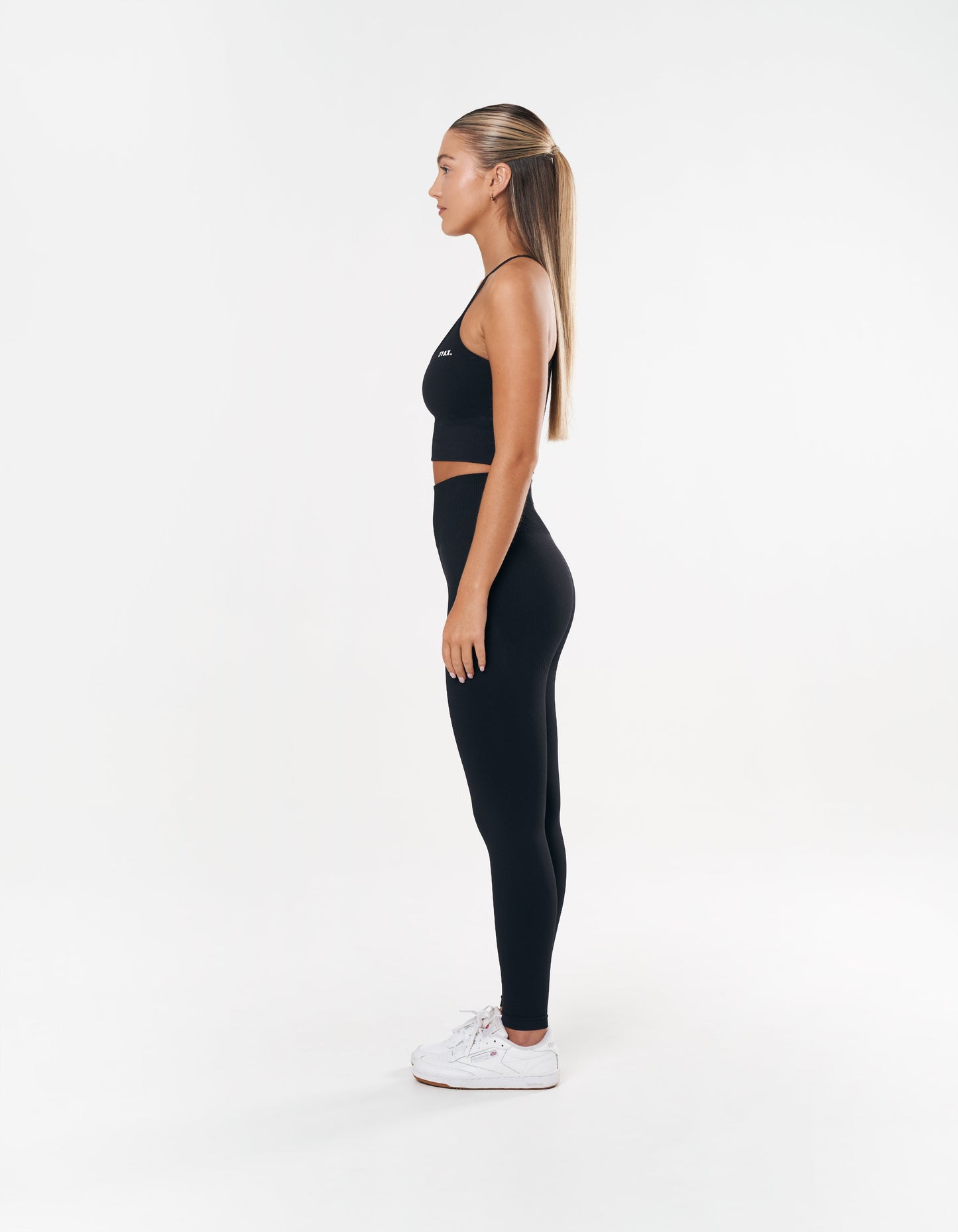 Side profile of STAX. Premium Seamless Tights in Astro showing flattering fit