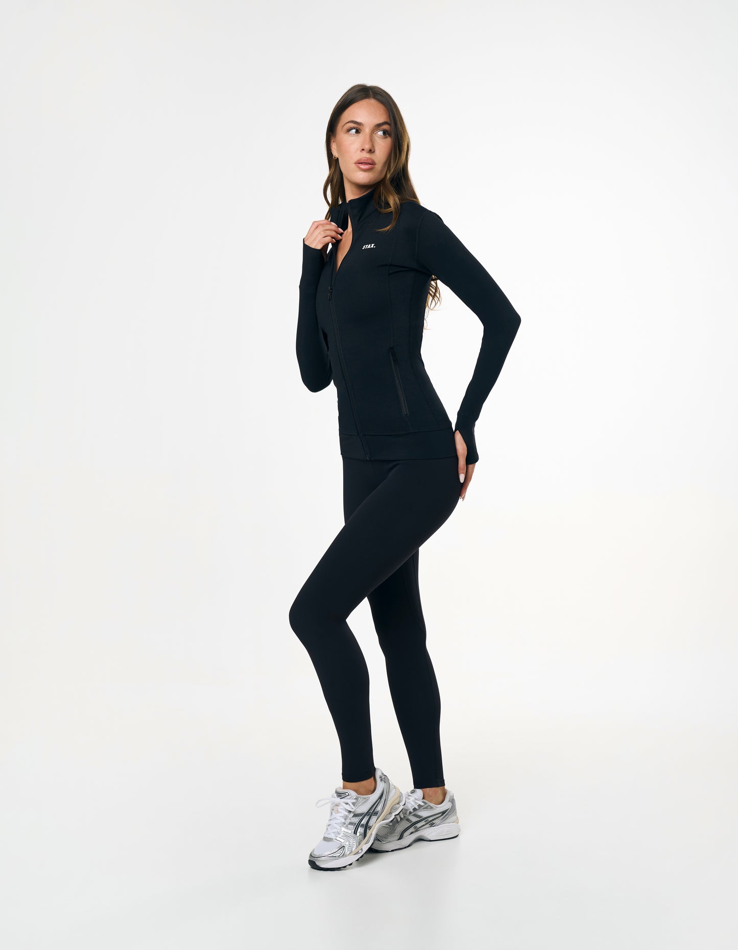Side profile of STAX. Zip Jacket NANDEX™ in Black showing waist support to accentuate your shape  