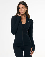 Front view of model wearing STAX. Zip Jacket NANDEX™ in Black with thumb holes