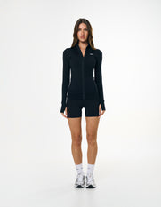 Front view of model wearing STAX. Zip Jacket NANDEX™ in Black with matching bike shorts 