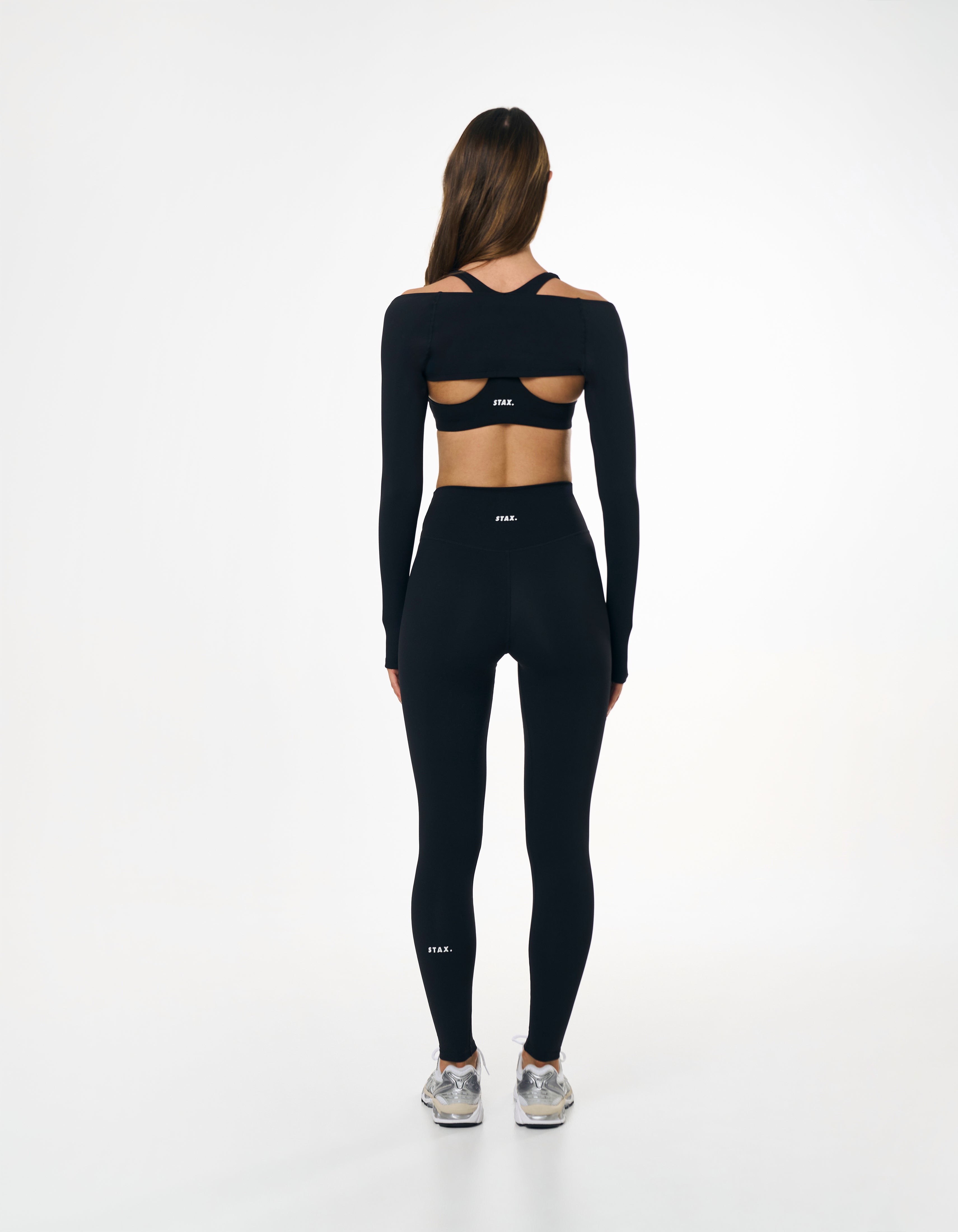 Back view of STAX. Full Length Tights NANDEX™ Original in black showing flattering design and white logo 