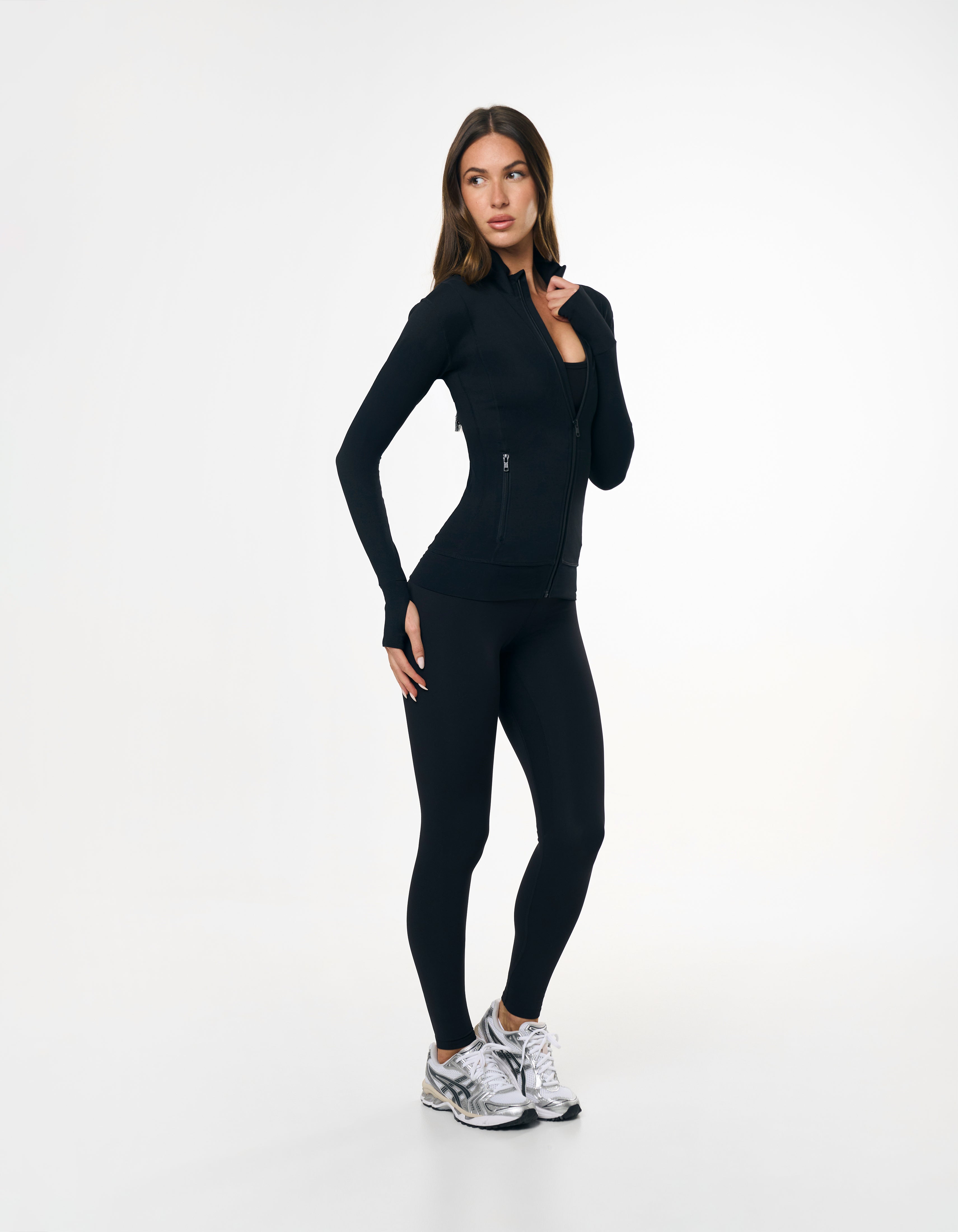 Front view of model wearing STAX. Full Length Tights NANDEX™ Original in Black  with matching Zip Jacket with thumb holes