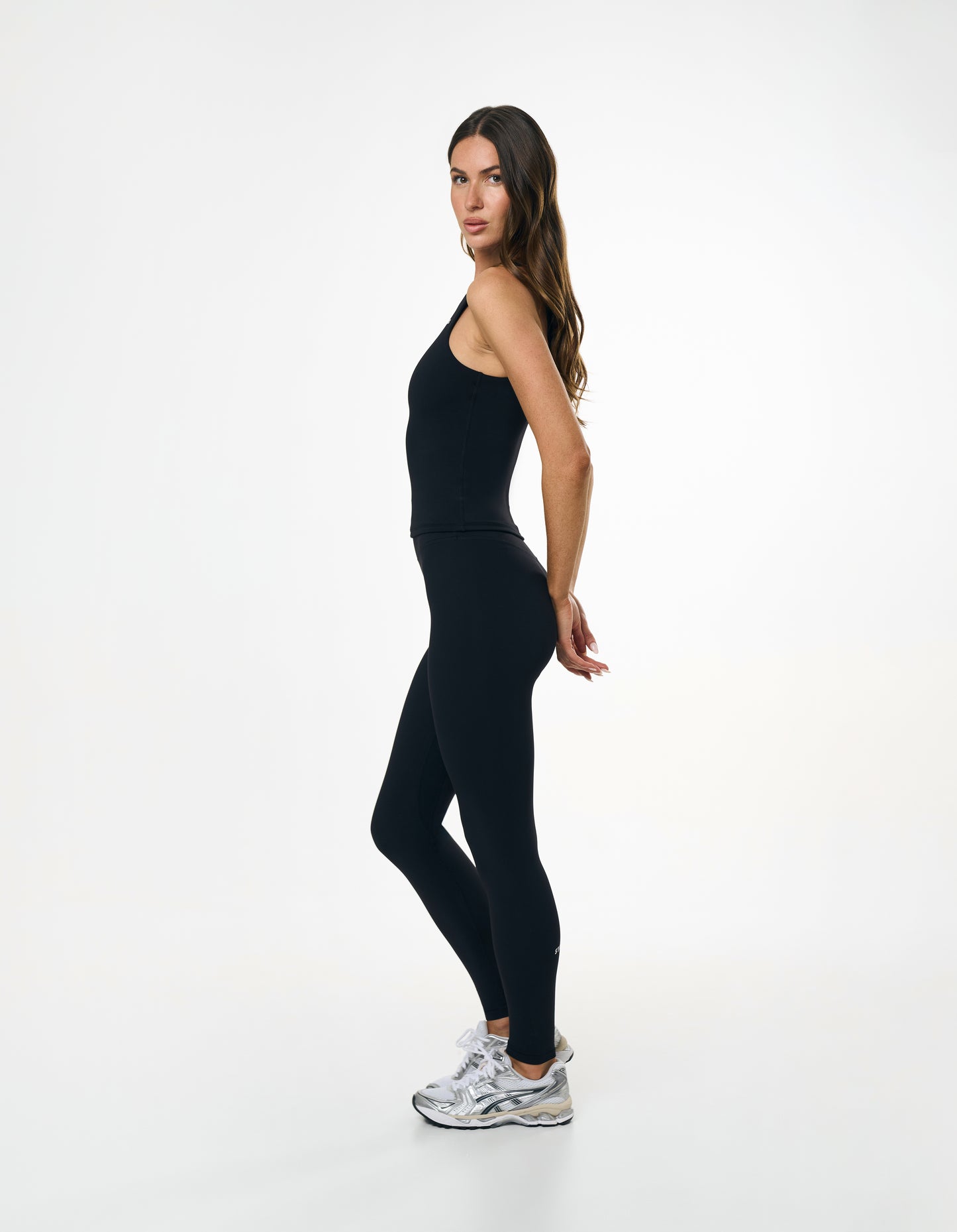 Side profile of STAX. Full Length Tights NANDEX™ Original in Black showing flattering tight fit and matching Body Tank NANDEX™