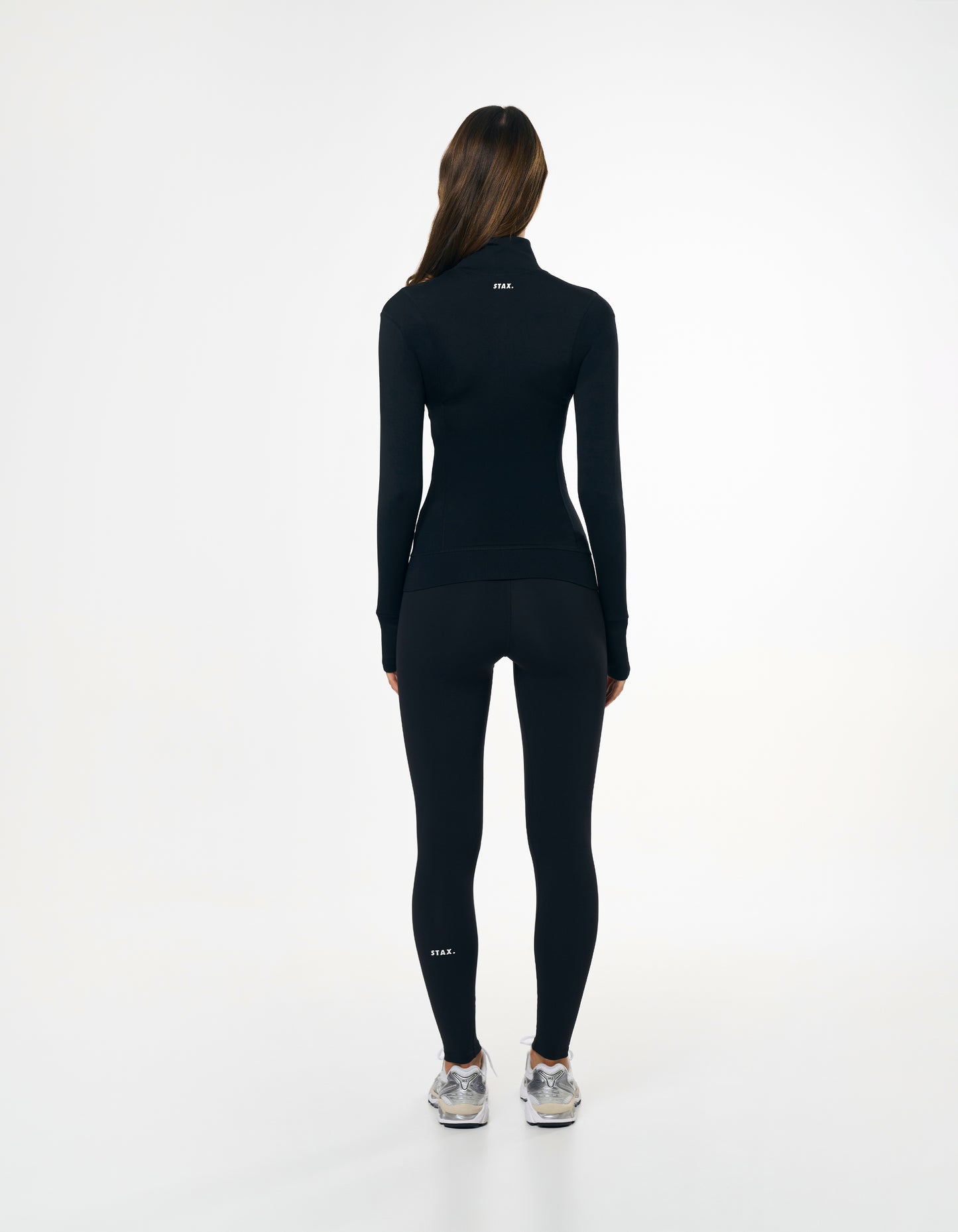 Back view of STAX. Zip Jacket NANDEX™ in Black showing flattering design and fit